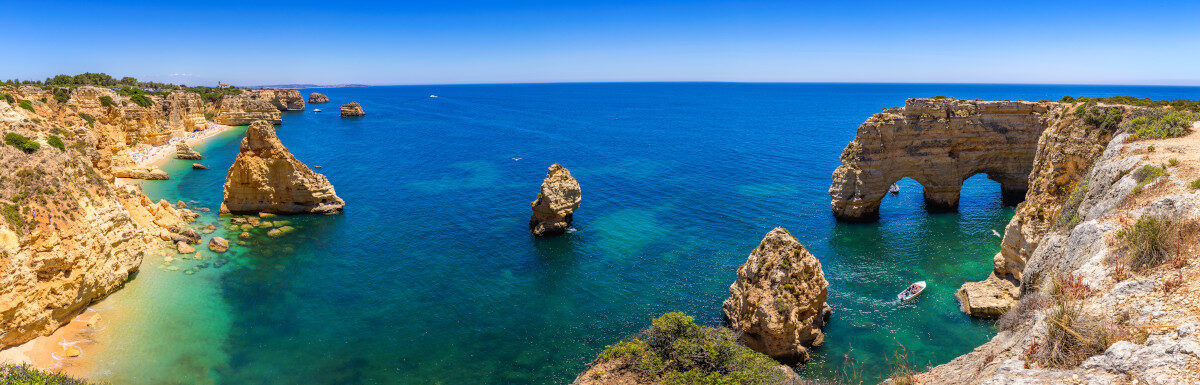 View of Marinha Beach with cliffs and turquoise waters in Algarve, Portugal