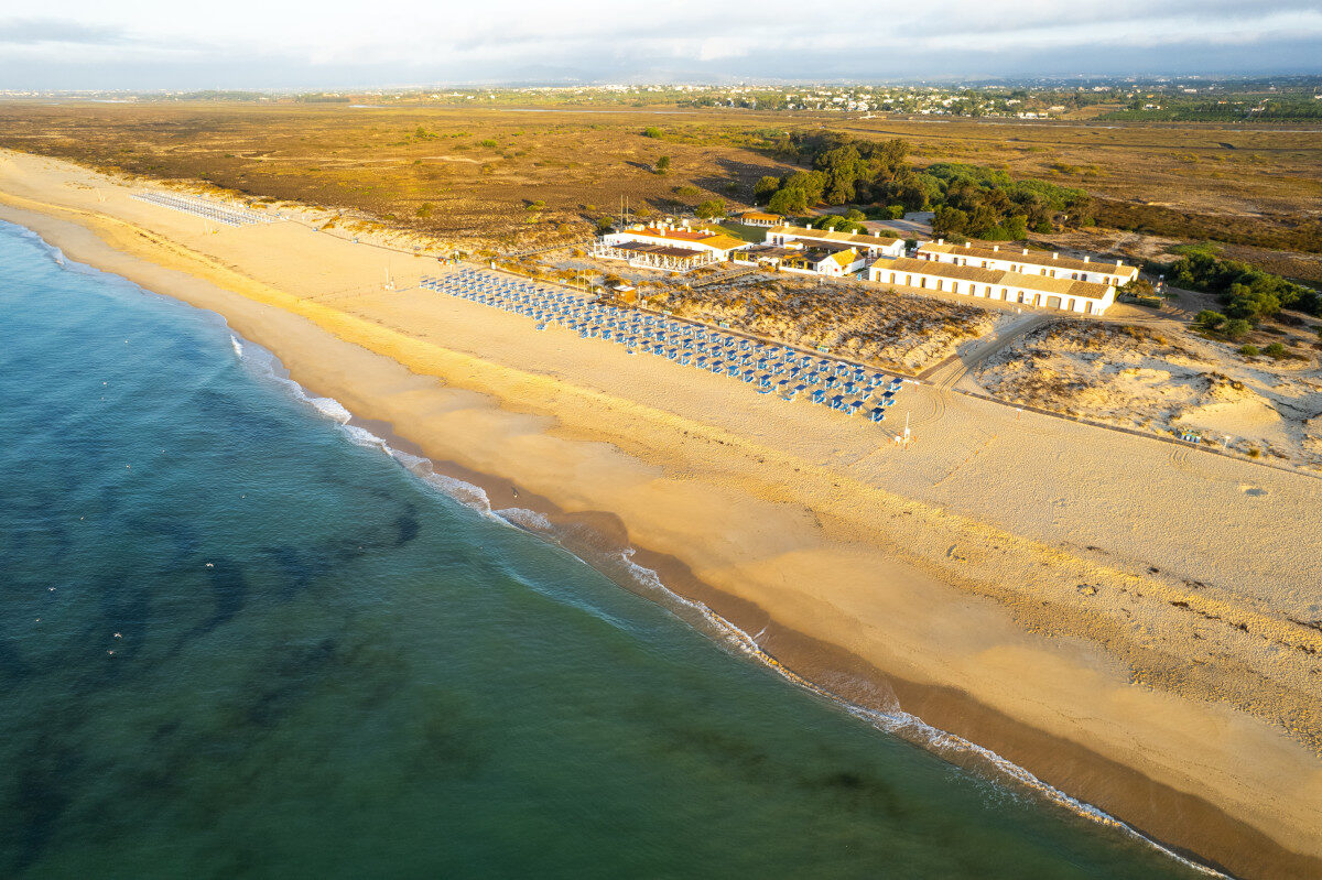 Aerial view of the wide sandy beach at Praia do Barril, Tavira, Algarve