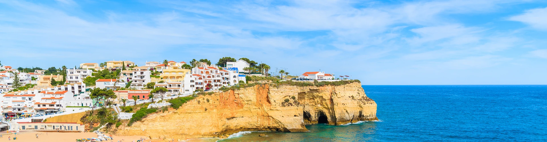 Beach and cliffs in Carvoeiro, Algarve, Portugal Beach and cliffs in Carvoeiro, Algarve, Portugal