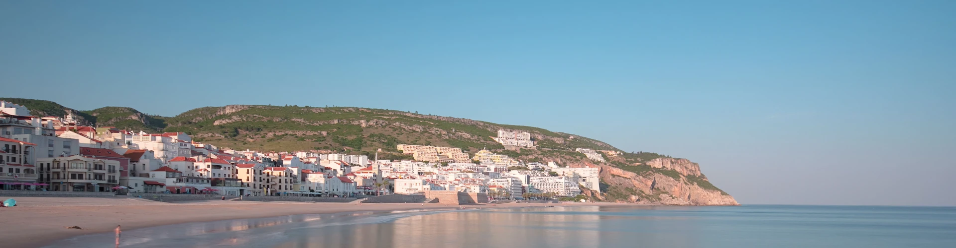 Sesimbra coastline with beach and hills, Portugal