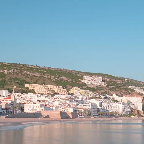 Sesimbra coastline with beach and hills, Portugal